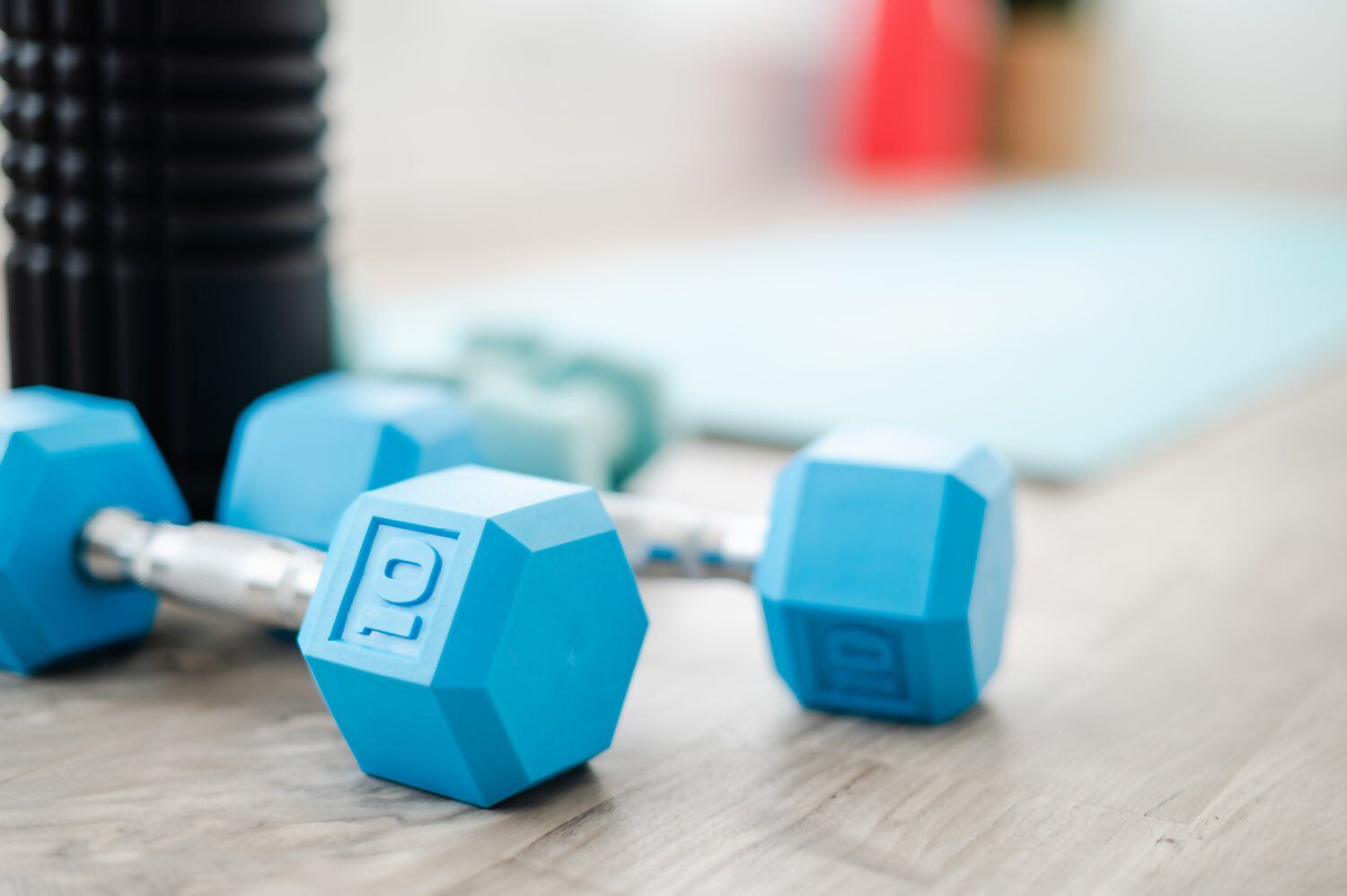 Pair of blue dumbbells on floor